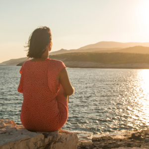 woman on beach at sunset