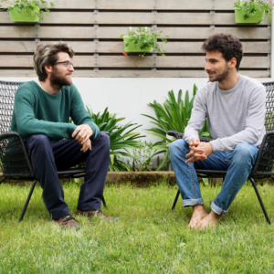 two men talking the garden