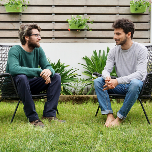 two men talking the garden