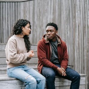 man and woman talking