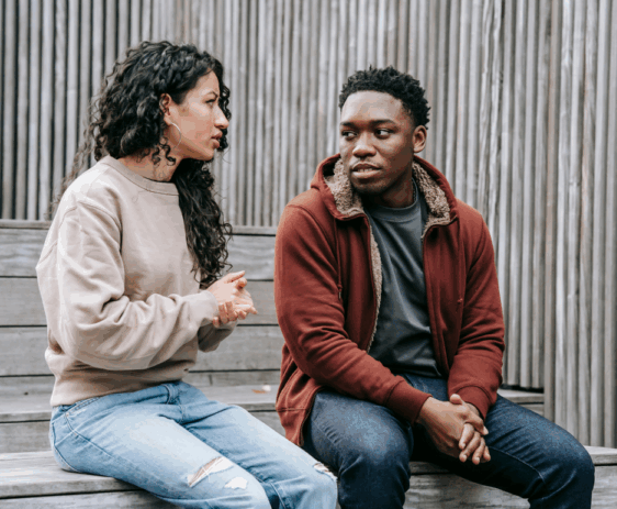 man and woman talking